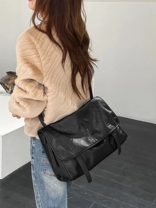 Vintage black matte messenger bag for women, large capacity shoulder bag shown on model