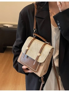 Retro color-block messenger bag in brown and beige leather shown at a 45-degree angle
