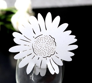 White daisy laser-cut paper wine glass place cards for wedding table decorations