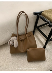 Brown litchi leather tote bag set with matching pouch and plush rabbit pendant detail