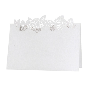 Elegant laser-cut butterfly place cards in white pearl paper for wedding table decor