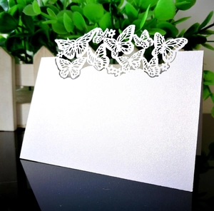 Detailed laser-cut butterfly hollow place card made of premium white pearlescent paper