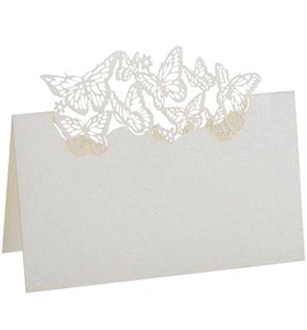 Macro detail of laser-cut 3D butterfly place card in pearl white folded paper