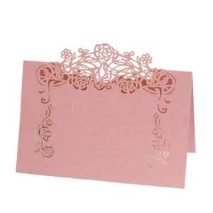 Pink laser-cut rose floral place cards with pearlescent shimmer for wedding table decor