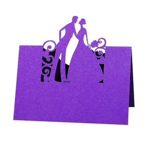 Detailed laser cut purple wedding place card featuring groom and bride silhouettes