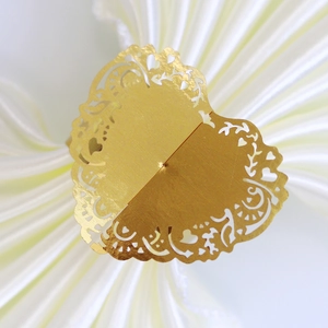 Laser cut hollow heart napkin ring in metallic gold finish for wedding table decor