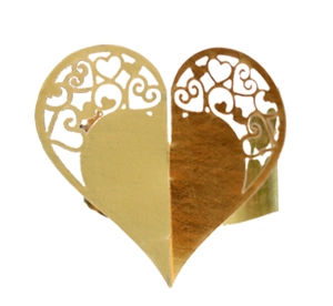Macro view of gold laser-cut heart hollow napkin ring with intricate pattern