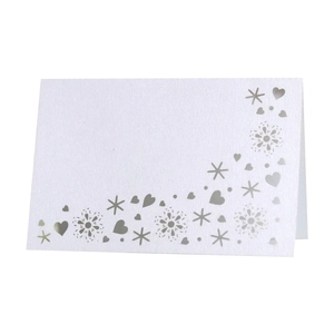 Elegant white laser cut table card with silver glitter snowflake and heart patterns