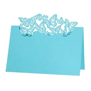 Sky blue laser-cut butterfly place cards for weddings featuring a folding design