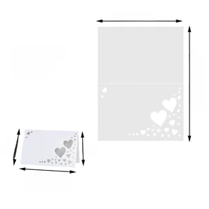 Macro detail of laser-cut heart pattern on white 50-count 12x9cm wedding table place cards