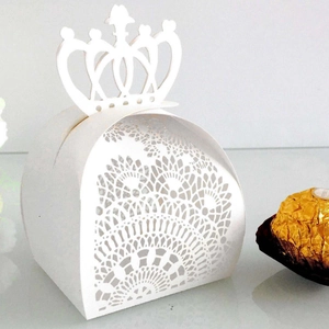 Detailed laser-cut white crown favor box with intricate lace pattern for wedding candy