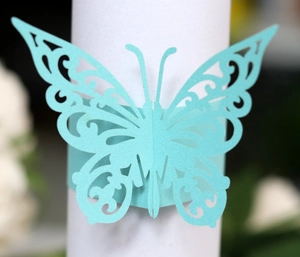 Detailed laser-cut light blue butterfly napkin ring with intricate lace pattern