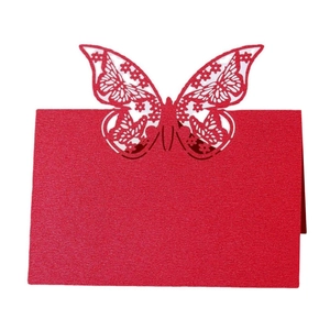 Detailed laser-cut red butterfly table card with pearlescent finish for weddings