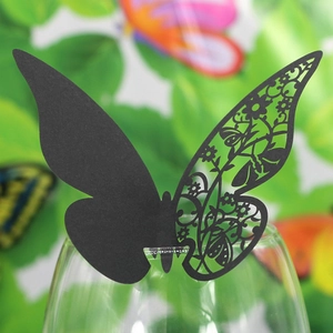 Laser-cut black butterfly glass card detail showing the intricate hollow-out design