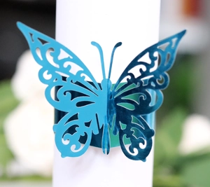 Elegant laser-cut blue butterfly napkin ring with intricate floral vine hollow patterns