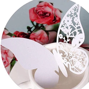 Elegant white laser-cut butterfly glass cards for wedding and party table decoration