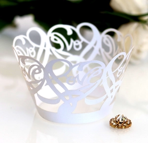 Laser cut white pearlescent cupcake wrappers with Love design and rhinestone buckle
