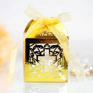 Golden laser-cut hollow candy box with cross pattern and elegant ribbon for weddings