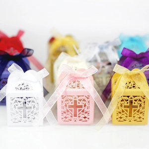 Laser cut hollow cross candy boxes with ribbons for wedding and baptism favors