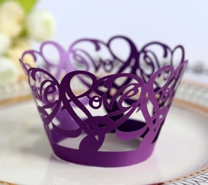 Macro detail of purple laser-cut cupcake wrapper with elegant Love heart pattern