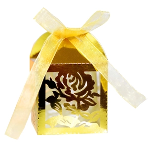 Elegant gold laser-cut rose hollow wedding favor box with a yellow ribbon bow