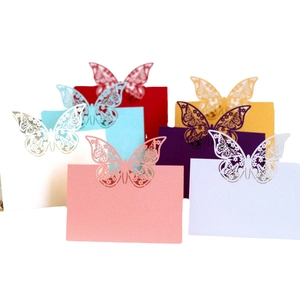 Assorted laser cut butterfly place cards in six vibrant colors for wedding table settings