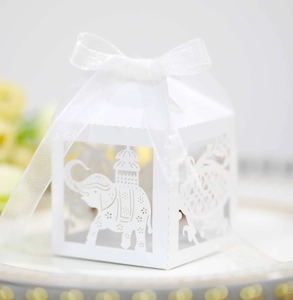 Detailed laser-cut candy box with elephant pattern and white organza ribbon bow