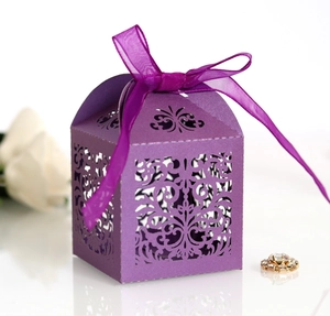 Elegant purple laser-cut wedding candy box with floral patterns and a satin ribbon bow