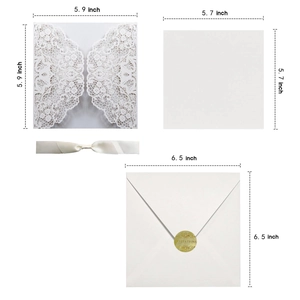 Detailed view of laser-cut wedding invitation set with dimensions and ivory ribbon