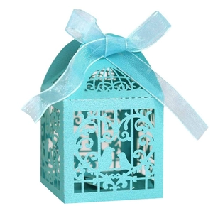 Laser-cut birdcage gift box in light blue cardstock with elegant ribbon bow decoration