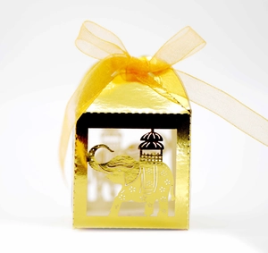 Golden laser-cut candy box with elephant pattern and ribbon bow for wedding favors