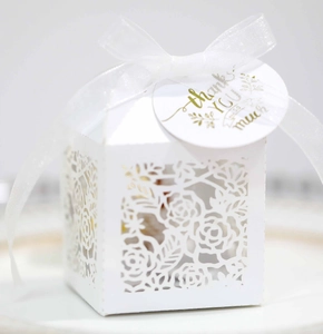 White laser-cut rose gift box with silk ribbon and gold Thank You gift tag