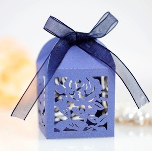 Elegant laser-cut hollow rose wedding favor box in purple with navy blue ribbon bow
