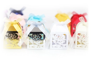 Laser cut hollow rose wedding favor gift boxes with elegant ribbon bows in various colors
