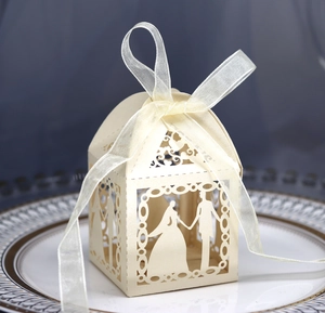 Detailed laser-cut wedding favor box featuring romantic bride and groom silhouette