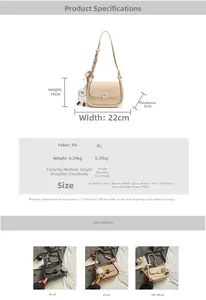 Detail view of semi-circle saddle bag with elegant chain and white plush ball charm accessory