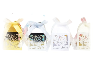 Set of four laser-cut hollow rose wedding favor boxes with organza ribbons in various colors