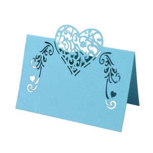 Sky blue laser-cut heart place card for weddings with elegant scroll pattern