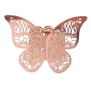 Detailed laser-cut butterfly napkin ring in rose gold for elegant wedding table settings