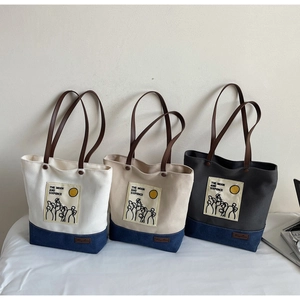 Three canvas tote bags with leather handles showing The Moon and Sixpence print detail