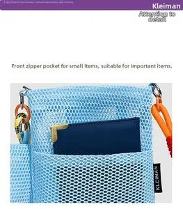 Detail of light blue mesh crossbody bag with front zipper pocket and card holder storage