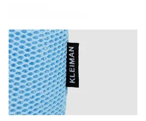 Detail shot of light blue mesh fabric bag with a black and white brand label