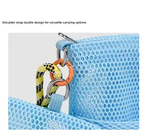 Detail of light blue mesh bag featuring a metal D-ring and orange carabiner attachment