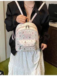 Cute cartoon bear printed mini backpack for women featuring pink floral patterns