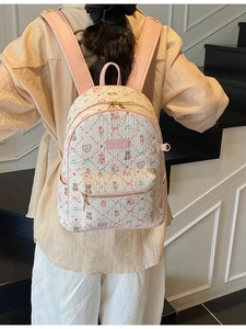 Pink quilted backpack for women featuring cute cartoon bear prints and stylish patterns
