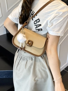 Chic beige and brown crossbody bag with square buckle and decorative pom-pom pendant