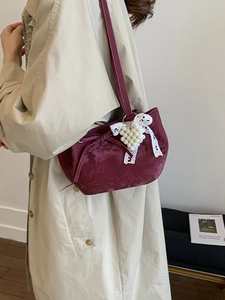 Burgundy velvet half-moon shoulder bag with lace bow and pearl pendant details
