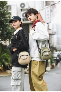 Detail of trendy nylon crossbody bags in beige and green for casual sport use