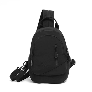 Close-up of durable black backpack showing three zip pockets and water-resistant fabric