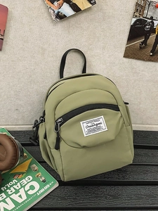 Stylish light green nylon mini backpack for women, perfect for daily commuting and sports